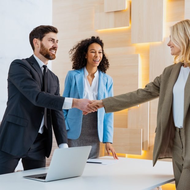 group-of-multiethnic-businesspeople-shaking-hands-for-a-business-deal.jpg